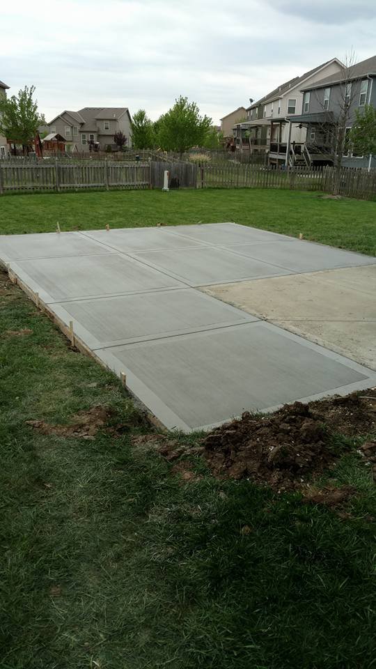 Residential concrete backyard slab installation in Kansas City