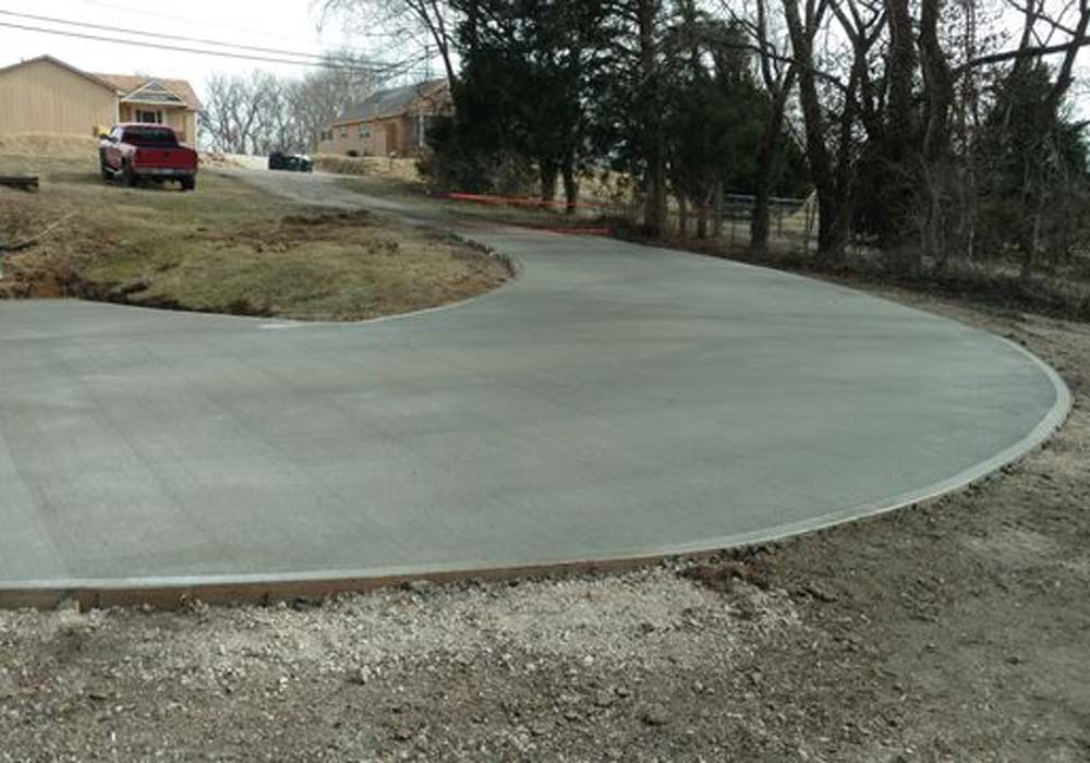 Curved residential concrete driveway installation in Kansas City