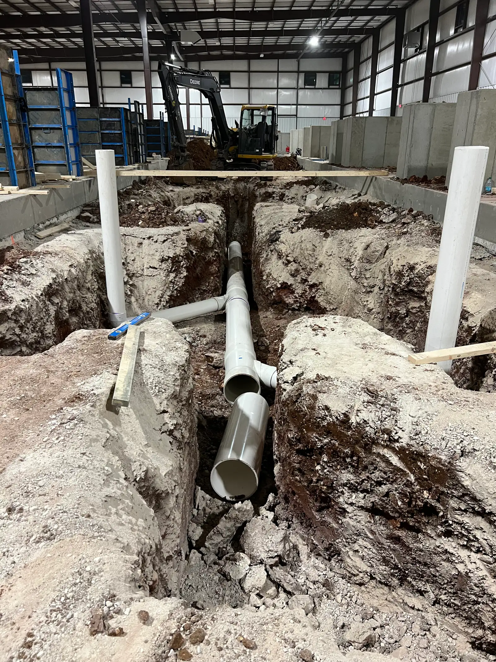 Commercial concrete foundation preparation inside a Kansas City warehouse building