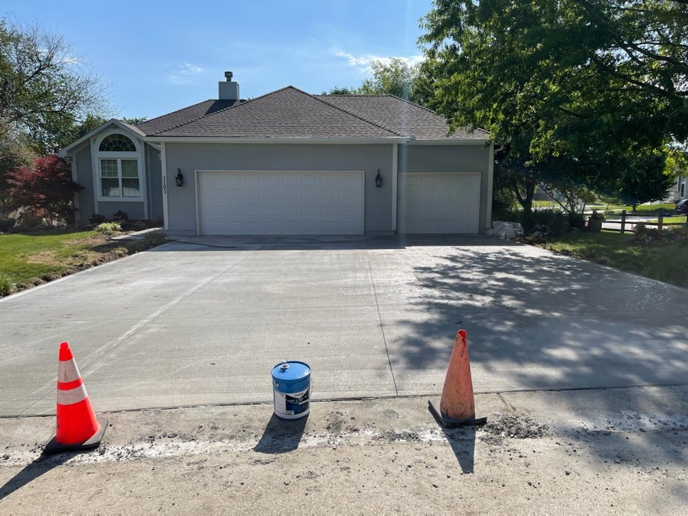 Three-car wide concrete driveway poured for a Kansas City area home